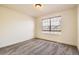 Cozy bedroom with carpet and large window overlooking the neighborhood at 19259 E Caspian Pl, Aurora, CO 80013