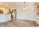 Spacious dining area with wood floors adjacent to the kitchen at 19259 E Caspian Pl, Aurora, CO 80013