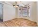 Dining room with hardwood floors, a modern chandelier, and large windows at 19259 E Caspian Pl, Aurora, CO 80013