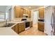 Charming kitchen featuring wooden cabinets and modern appliances at 19259 E Caspian Pl, Aurora, CO 80013