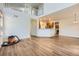 Bright, open living room leading to a kitchen area and featuring a loft at 19259 E Caspian Pl, Aurora, CO 80013