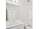 Bright bathroom features a white vanity, toilet, and bathtub at 8869 Sedalia St, Commerce City, CO 80022