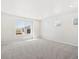 Bright bedroom featuring neutral walls and carpeted floors at 8869 Sedalia St, Commerce City, CO 80022