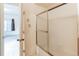 Bathroom showcasing a glass-door shower/tub combination at 908 S Yampa St # 208, Aurora, CO 80017