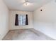Carpeted bedroom with natural light and neutral colored walls at 908 S Yampa St # 208, Aurora, CO 80017