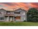 Inviting exterior showcasing a well-maintained townhouse with manicured lawn and covered balcony at 908 S Yampa St # 208, Aurora, CO 80017