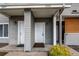 Charming front entrances with visible unit numbers and welcoming mats at 908 S Yampa St # 208, Aurora, CO 80017