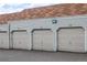 Row of garages with overhead doors at 908 S Yampa St # 208, Aurora, CO 80017