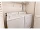 Laundry room features white washer and dryer at 908 S Yampa St # 208, Aurora, CO 80017