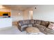 Cozy living room adjacent to the kitchen, bathed in natural light at 908 S Yampa St # 208, Aurora, CO 80017