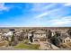 Expansive aerial view showcasing a meticulously landscaped property within a beautiful residential neighborhood at 12532 Daniels Gate Dr, Castle Pines, CO 80108