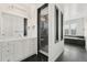 Modern bathroom with a glass-enclosed shower, sleek vanity, and tiled flooring at 12532 Daniels Gate Dr, Castle Pines, CO 80108