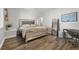 Cozy bedroom features modern decor and wood flooring at 12532 Daniels Gate Dr, Castle Pines, CO 80108