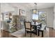 Dining room with stone fireplace and large windows at 12532 Daniels Gate Dr, Castle Pines, CO 80108