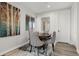 Bright dining area featuring four chairs around a round table and modern décor at 12532 Daniels Gate Dr, Castle Pines, CO 80108