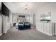 Beautiful main bedroom with stylish decor, a tufted headboard, and dual blue upholstered chairs at 12532 Daniels Gate Dr, Castle Pines, CO 80108