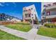 Modern townhouses with green lawn and sidewalk at 1216 Perry St, Denver, CO 80204