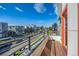 Enjoy outdoor living with city views from this charming balcony with a metal guardrail and wood flooring at 1216 Perry St, Denver, CO 80204