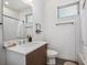 Bathroom with white subway tile shower and modern vanity at 1216 Perry St, Denver, CO 80204