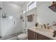 Modern bathroom features a glass-enclosed shower, sleek fixtures, and a floating vanity at 1216 Perry St, Denver, CO 80204