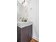Contemporary powder room featuring a sleek vanity with modern fixtures and natural light at 1216 Perry St, Denver, CO 80204