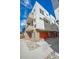 Modern townhome building with orange garage doors at 1216 Perry St, Denver, CO 80204