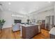 Open concept kitchen with island and stainless steel appliances at 1216 Perry St, Denver, CO 80204