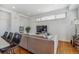 Living room with sectional sofa and large window at 1216 Perry St, Denver, CO 80204