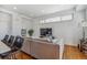Cozy living room featuring a sectional sofa, modern decor, and adjacent bar seating and kitchen area at 1216 Perry St, Denver, CO 80204