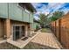 Backyard patio with stairs leading to the basement door at 3722 Monterey Pl, Boulder, CO 80301