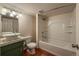 Bathroom featuring a white vessel sink, tub-shower combo, and tile floors at 3722 Monterey Pl, Boulder, CO 80301