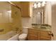 Bathroom featuring a shower-tub combo with a glass door, and a stylish sink and vanity at 3722 Monterey Pl, Boulder, CO 80301