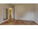 Bright bedroom featuring terra cotta tile floors, closet, and doorway to an adjoining bathroom at 3722 Monterey Pl, Boulder, CO 80301