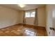 Cozy bedroom with tile flooring and a window at 3722 Monterey Pl, Boulder, CO 80301