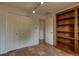 Bedroom featuring terra cotta tile floors, a closet and wooden bookcase at 3722 Monterey Pl, Boulder, CO 80301