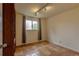 Bright bedroom with tile floors and a window providing ample natural light at 3722 Monterey Pl, Boulder, CO 80301