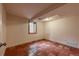 Cozy bedroom featuring red tile flooring and a window for natural light at 3722 Monterey Pl, Boulder, CO 80301