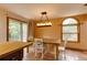 Dining area with a wooden table, chairs, and a sliding glass door leading to the outside at 3722 Monterey Pl, Boulder, CO 80301