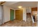 Foyer showcases tile flooring, a green accent door, closet and staircase leading to the upper level at 3722 Monterey Pl, Boulder, CO 80301