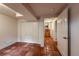 Hallway with red tile flooring, closet, and entryway to other rooms at 3722 Monterey Pl, Boulder, CO 80301