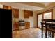 Kitchen with stainless steel appliances, wood cabinets and terra cotta tile floors at 3722 Monterey Pl, Boulder, CO 80301