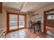 Eating area in kitchen with terra cotta tile floors with sliding door to outdoors at 3722 Monterey Pl, Boulder, CO 80301