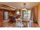 Modern kitchen and dining area boast stainless steel appliances, wood cabinets, skylights, and sliding glass doors to the backyard at 3722 Monterey Pl, Boulder, CO 80301
