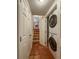 A laundry room features new, stacked washer and dryer and tile flooring at 3722 Monterey Pl, Boulder, CO 80301