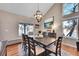 Bright dining room with chandelier and hardwood floors at 4702 S Biscay Ct, Aurora, CO 80015