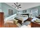 Tranquil main bedroom with vaulted ceilings, many windows, and hardwood flooring at 4702 S Biscay Ct, Aurora, CO 80015