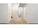 Finished basement with carpet, multiple storage closets, stairs, and a view of the outside at 13561 W Alaska Pl, Lakewood, CO 80228