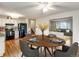 Charming kitchen and dining area featuring modern appliances and hardwood floors at 13561 W Alaska Pl, Lakewood, CO 80228