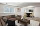 Finished basement with carpet, sofa, coffee table, game table and chairs, and natural light from the windows at 13561 W Alaska Pl, Lakewood, CO 80228