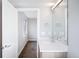 Bathroom features vanity with stone countertop and large mirror at 1930 Grove St # 2, Denver, CO 80204